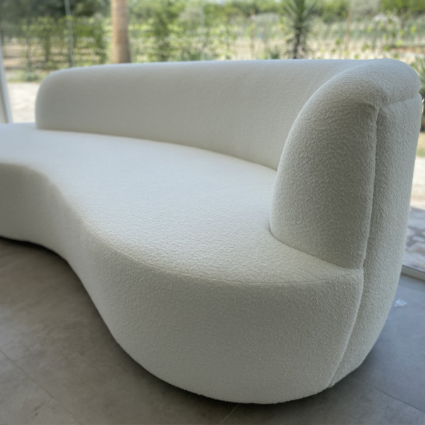 The most popular of all the interior trends in the current market and a favourite with all the designers; this boucle’ sofa is fashionable and snug. Upholstered in cozy white textured fabric and carved in soft curves, this sofa is a treat for those with a discerning eye for interiors.

- white textured upholstery
- solid wood frame
- colon curve cut
- upholstery options available in store
ENQUIRE NOW